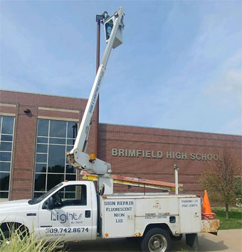 Upgrading a pole light to LED outside Brimfield High School
