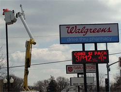 Repairing an exterior pole light in Walgreens parking lot